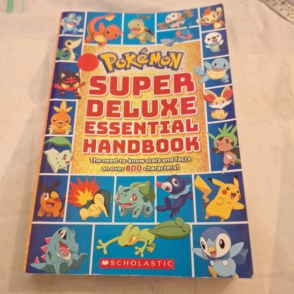 Super Deluxe Essential Handbook (Pokemon): The Need-to-Know Stats and Facts - Picture 1 of 3
